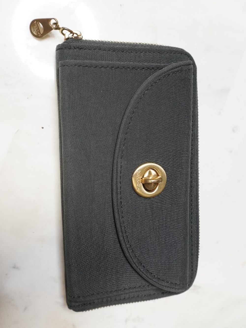 Grey Baggallini Kyoto RFID wallet features a gold-tone turn-lock clasp